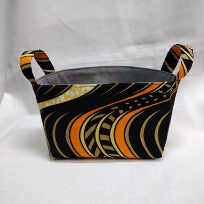 <span style="color: #ff6347; font-style: bold;">【売切】</span><br>056<br>アフリカ布で作った小物入れ（小）<br>オレンジ＆ブラウン