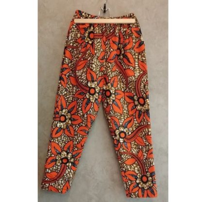 <span style="color: #ff6347; font-style: bold;">【売切】</span><br>086<br>アフリカ布の<br>タックパンツ<br>オレンジフラワー