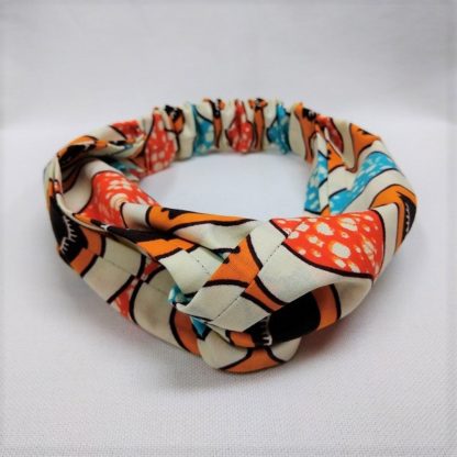 <span style="color: #ff6347; font-style: bold;">【売切】</span><br>183<br>アフリカ布の<br>ヘアバンド<br>ホワイト＆オレンジ